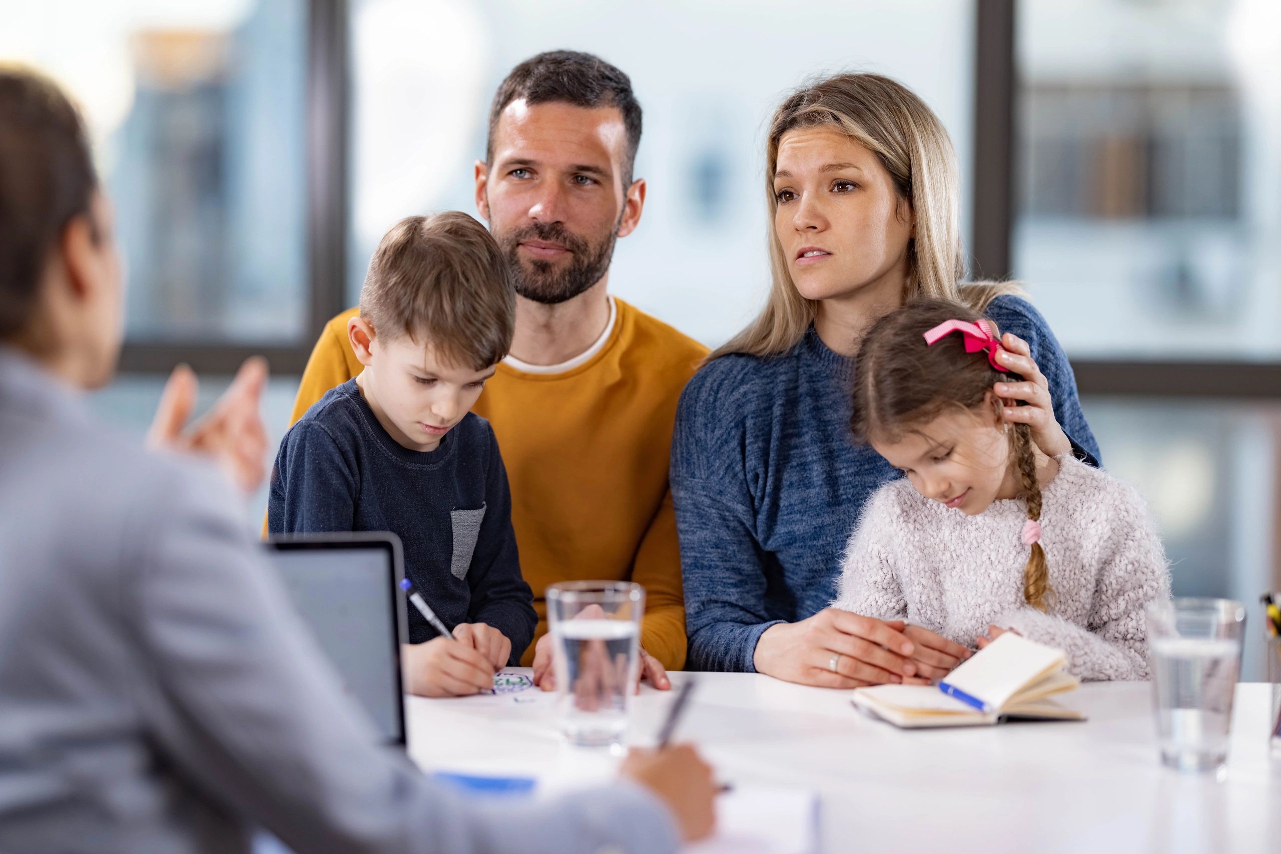 Family meeting with a therapist in a supportive office setting
